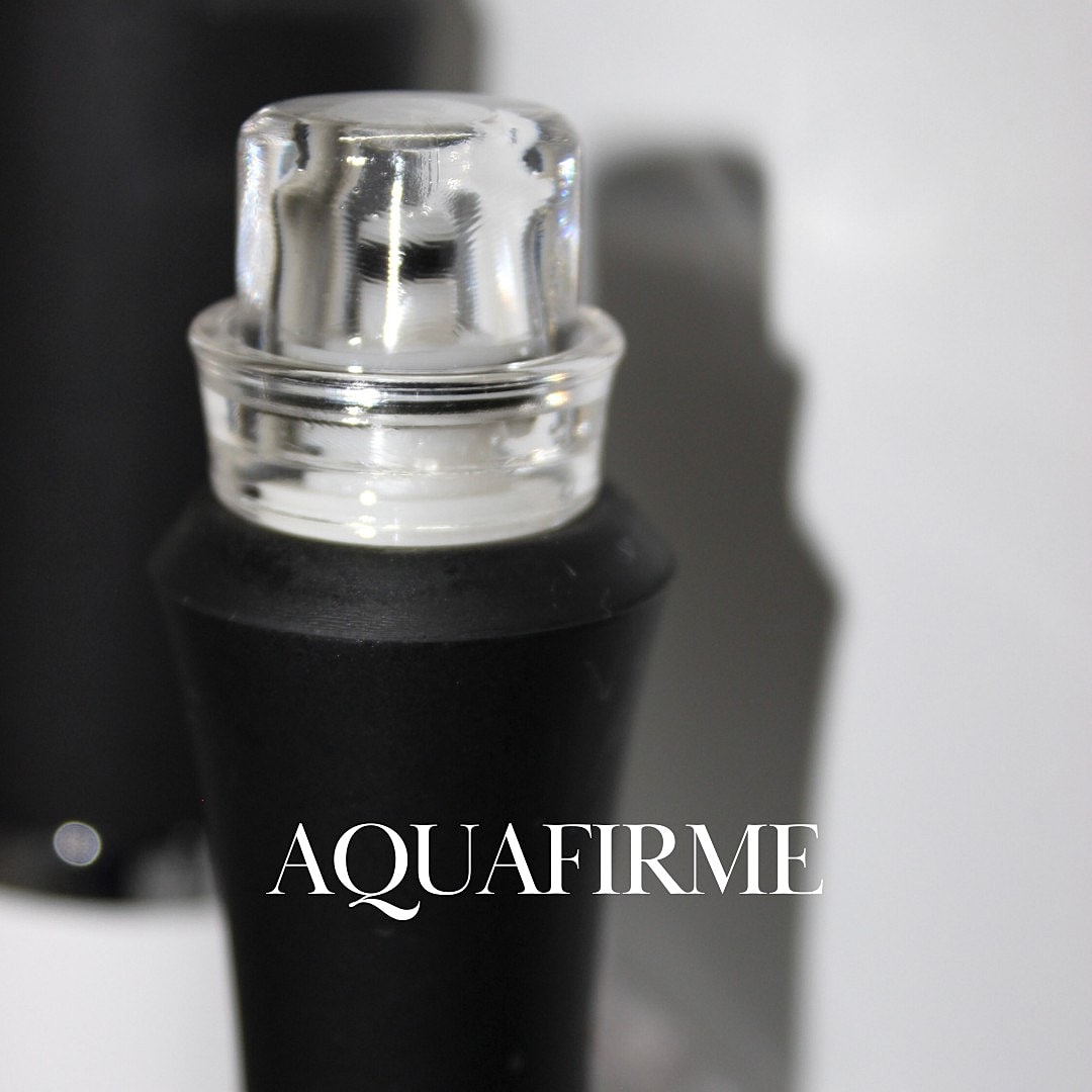 Black bottle with clear cap, labeled Aquafirme.